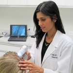 Dr. Shah diagnosing hair loss in women using densitometer