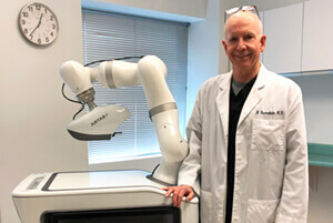 Dr. Bernstein with the ARTAS iX Robotic Hair Transplant System