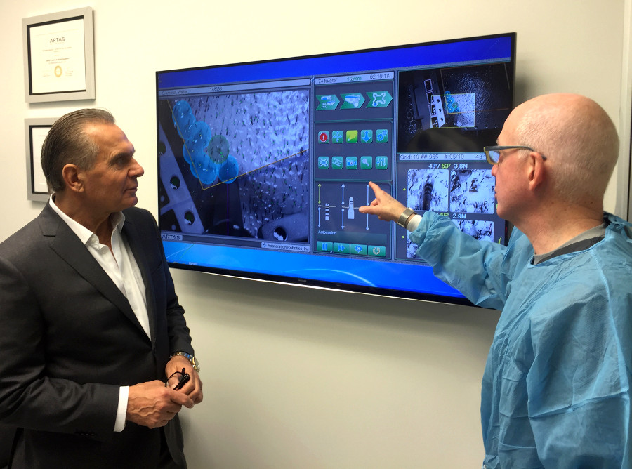 Dr. Ordon and Dr. Bernstein discussing the latest advances in the ARTAS® Robotic Hair Transplant System