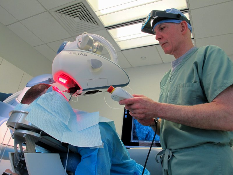 Dr. Bernstein performing robotic hair transplant at Bernstein Medical