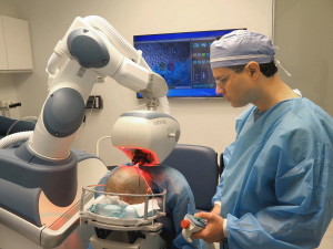 Dr. Wolfeld Using the ARTAS Robot to Perform Robotic FUE